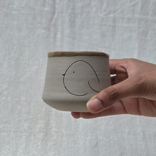 Compact Ceramic Tumbler with Playful Curved Form