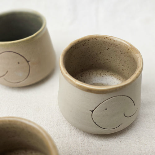 Compact Ceramic Tumbler with Playful Curved Form