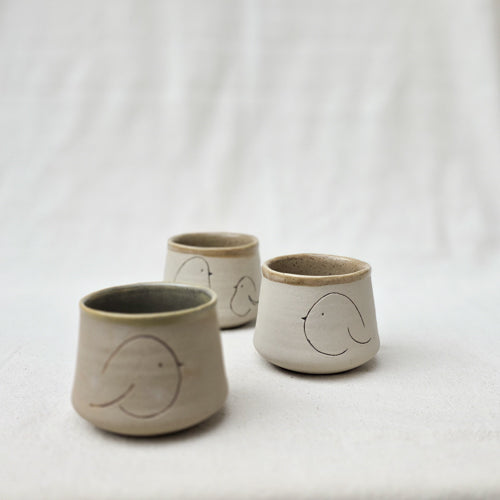 Compact Ceramic Tumbler with Playful Curved Form