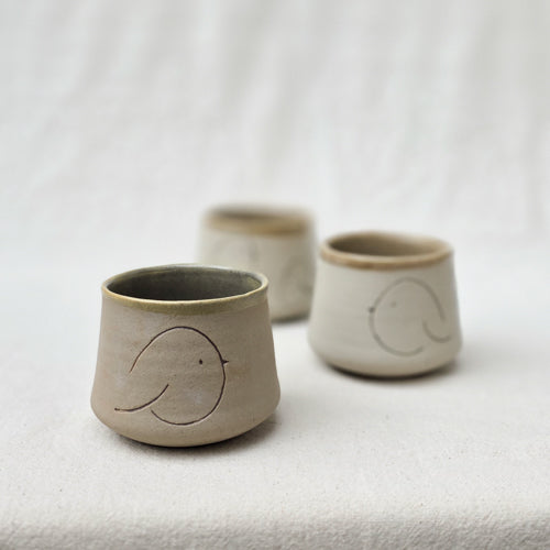 Compact Ceramic Tumbler with Playful Curved Form